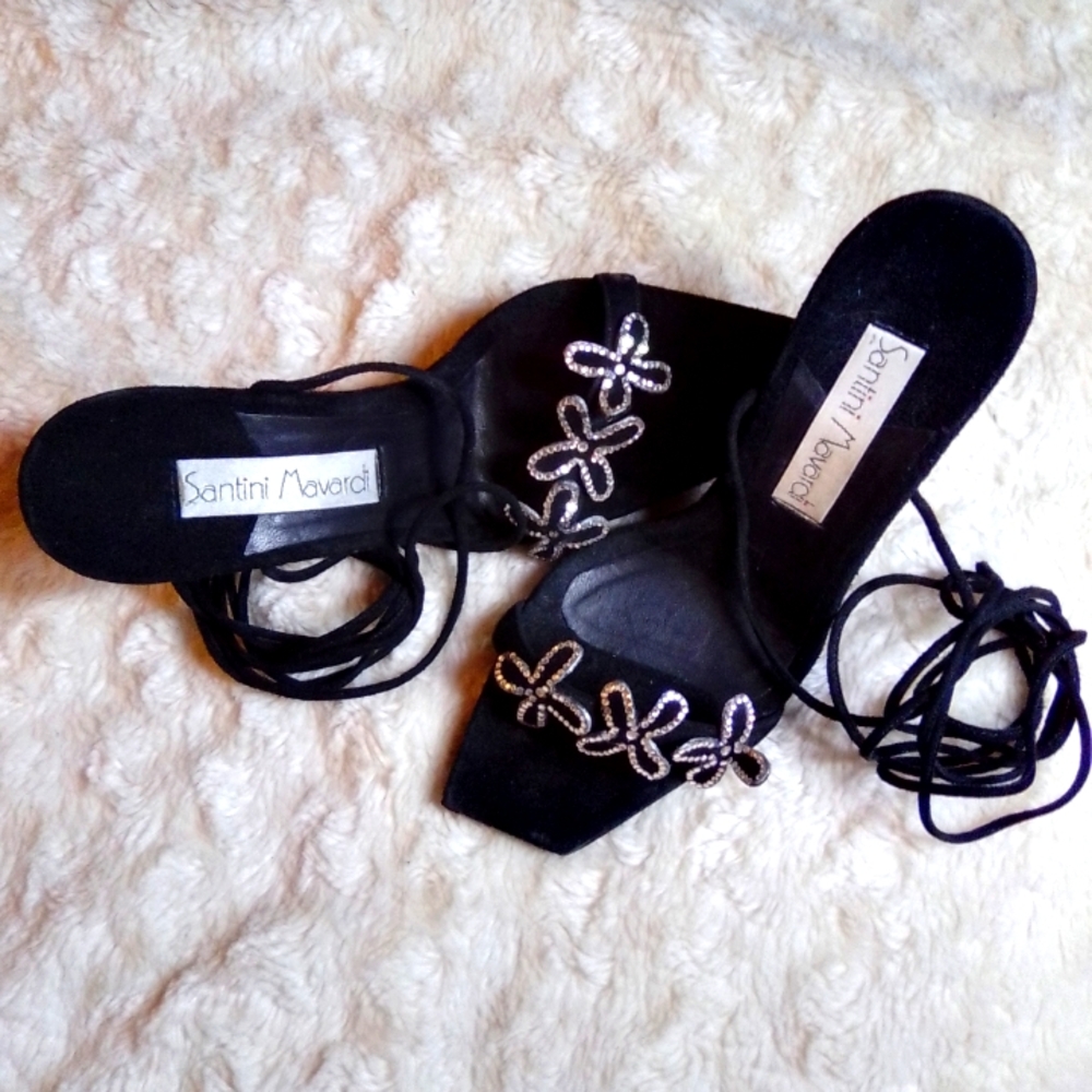 Authentic "Santini Mavardi". Lace up,suade heels w/ a sparkly flower design.